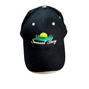 Sunset Bay Black Baseball Cap. Adjustable. On Cobra Tag